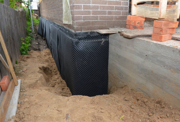 SJ Waterproofing Pros technician performing targeted Wet Basement Repair assessment in Hobbs, IN